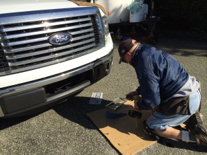 Phil putting on the SD plates in such a way that they are not easy to remove.